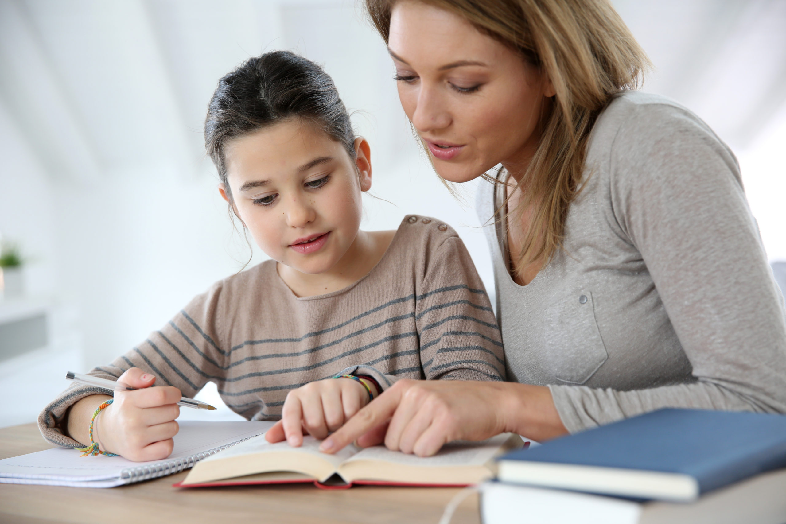Mother homeschooling her child with Euka