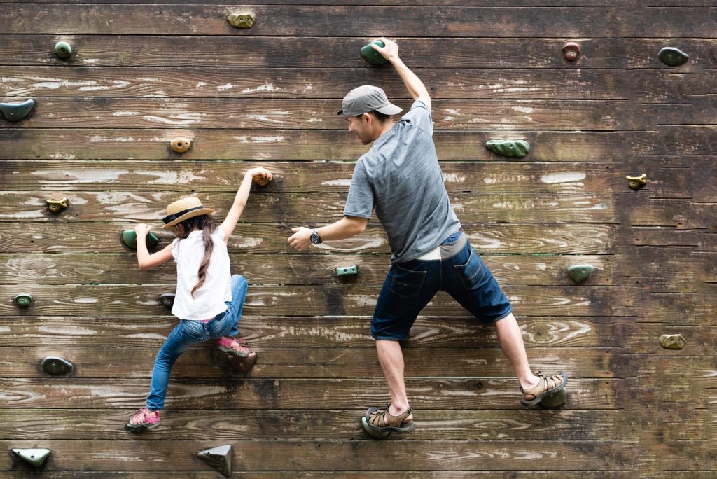father & daughter climbing - teaching her failure is a step to success