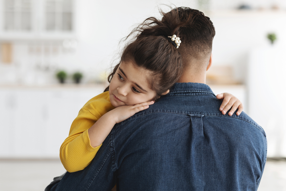 father and daughter sharing a tender moment togther