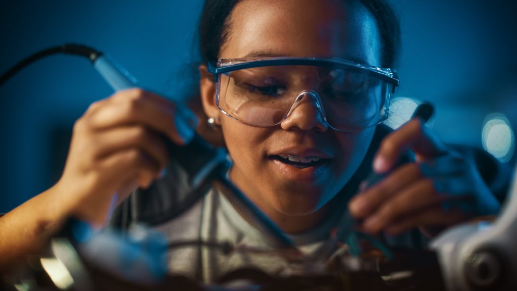 Schoolgirl studying electronics